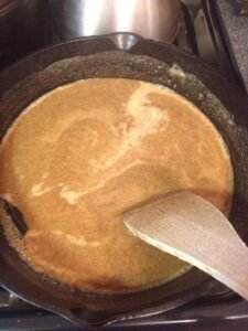 2. Dark Roux in progress.. first stage, this wouldn't even be the color of your basic roux, I'm gonna keep stirring. GO DARKER, IF YOU DARE!