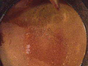 4. OMG! It's gonna come off the stove and kill me - I'm a little scared! Time to neutralize it: turn the heat down to lowest setting and stir in your stock, one half at a time.